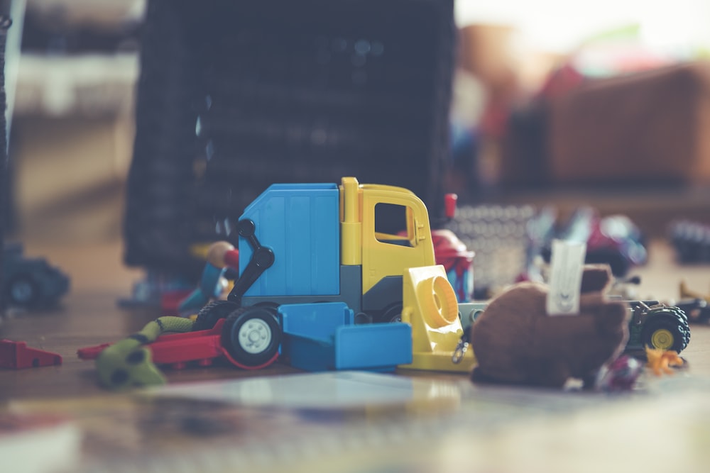 assorted-color toys on gray concrete paving