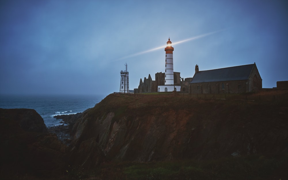 selective focus photography of white lighthouse
