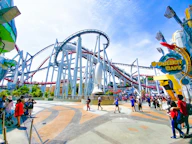 people of amusement park under clear blue sky during daytime