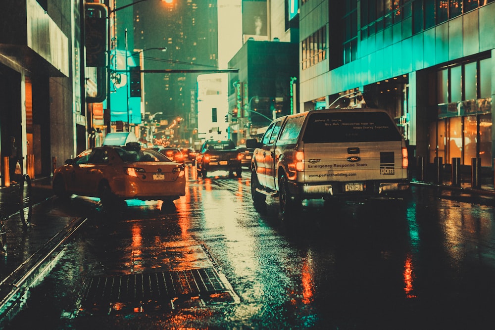 white car on wet asphalt road