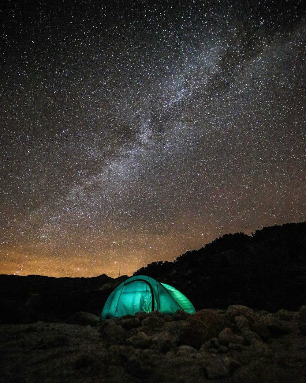 green tent under sky with stars