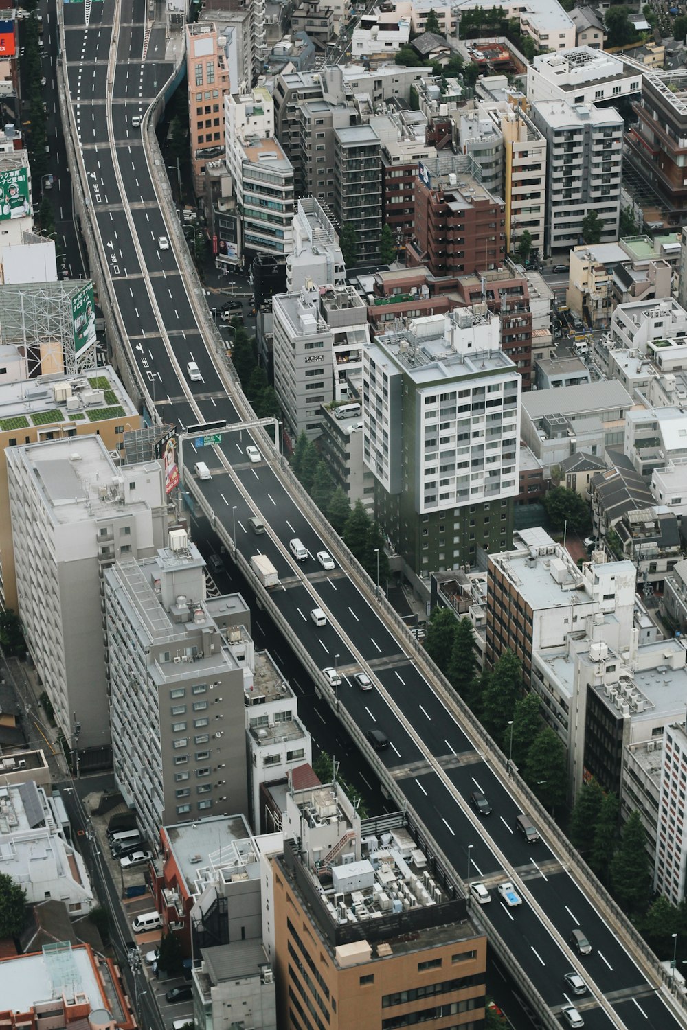 aerial photo of black asphalted road with vehicles on top