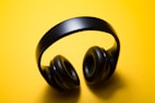 wireless headphones with yellow background