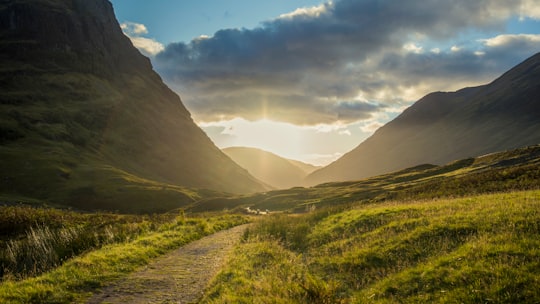 landscape photography of mountain range facing sun rise in Scotland United Kingdom