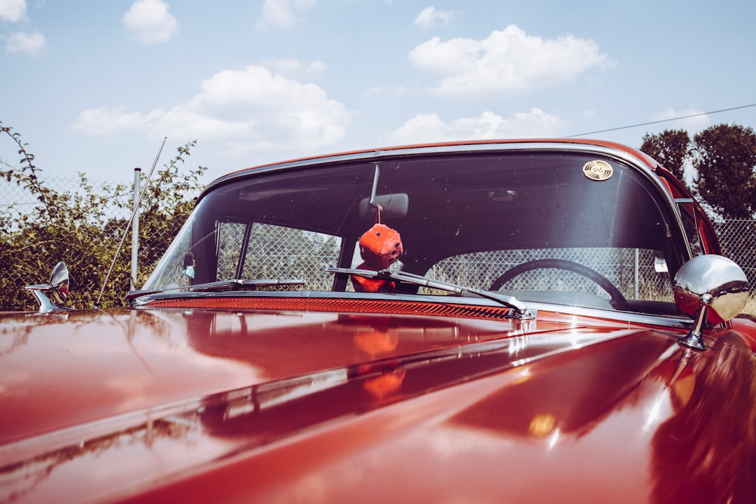 classic red car closeup photography