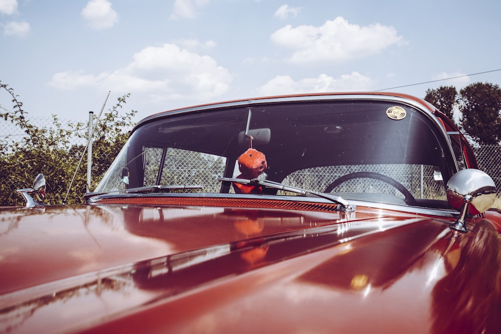 classic red car closeup photography