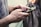Close-up of hands exchanging a positive review on a mobile device.