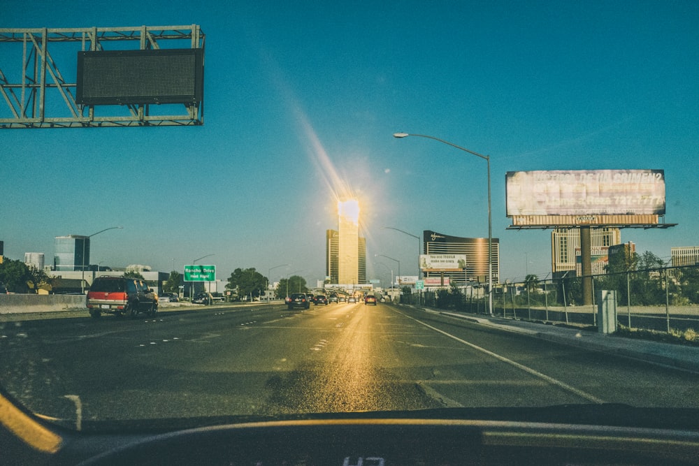 a view of a city street from inside a car