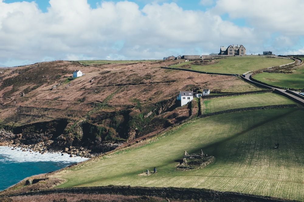 landscaped photo of a land besides body of water