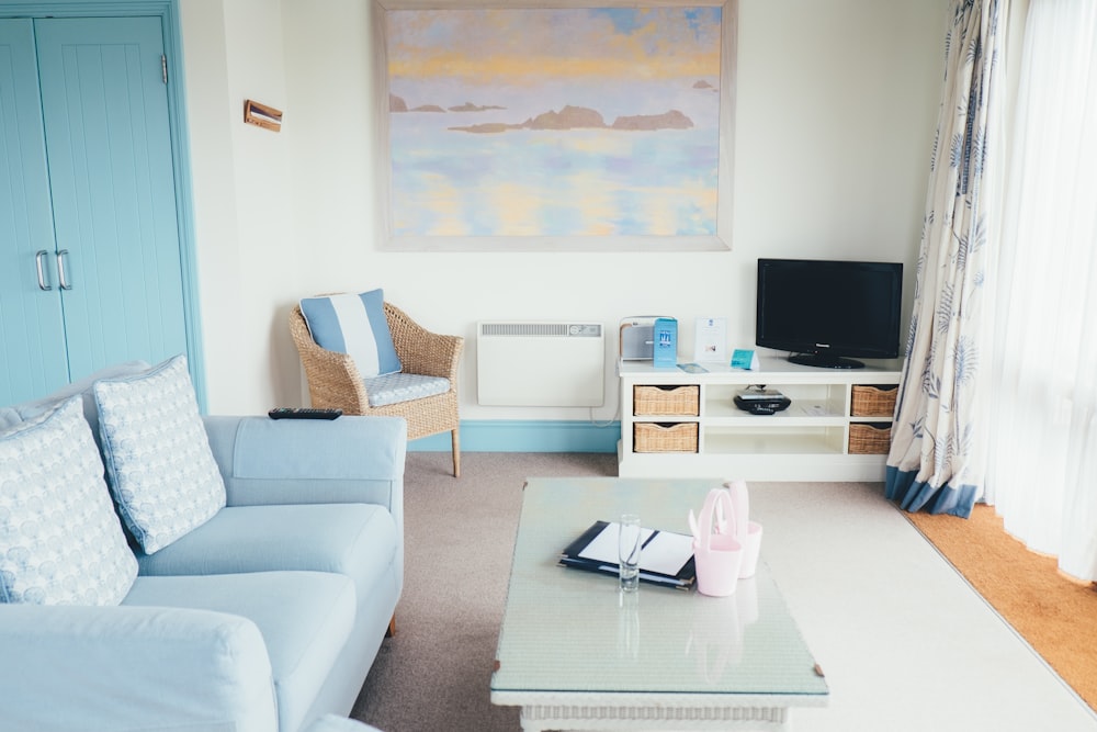 empty gray fabric sofa beside coffee table