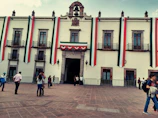 Institutional building facade decorated with blue and white banners representing the association