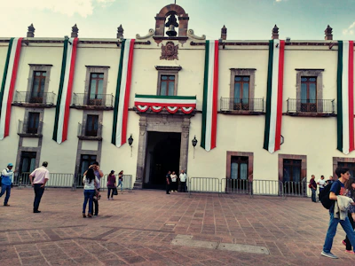 Institutional building facade decorated with blue and white banners representing the association