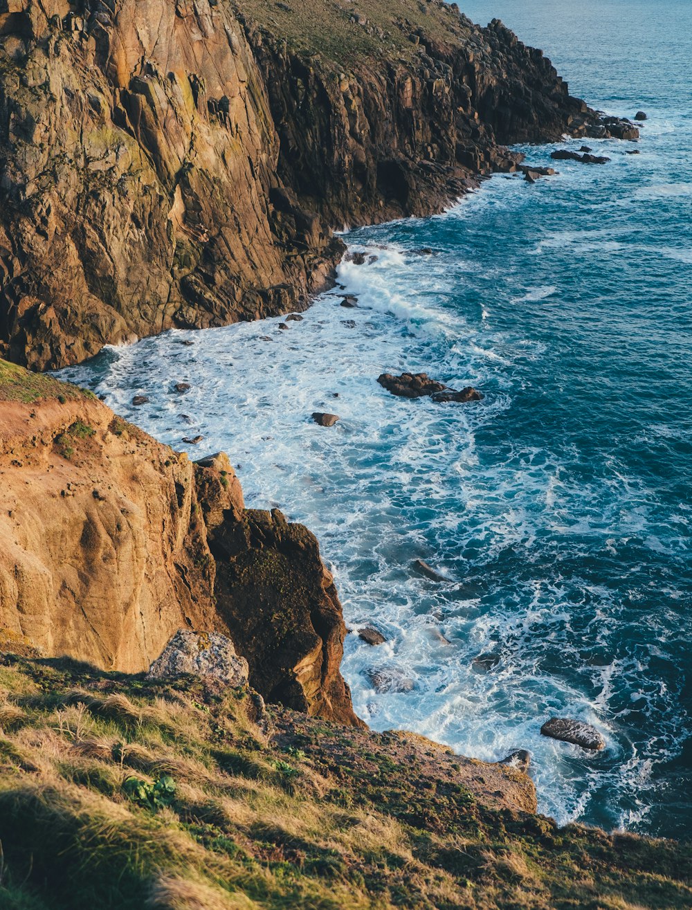 photo of hilltop near body of water