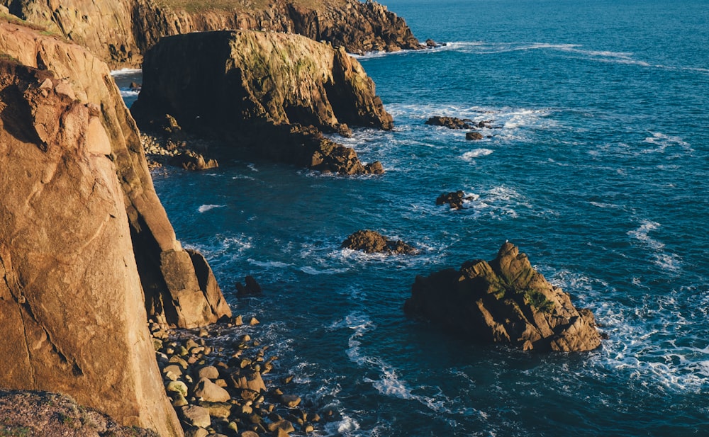 rock formation beside sea photo