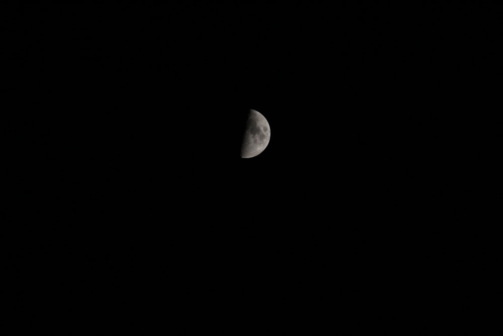 grayscale photography of half-moon