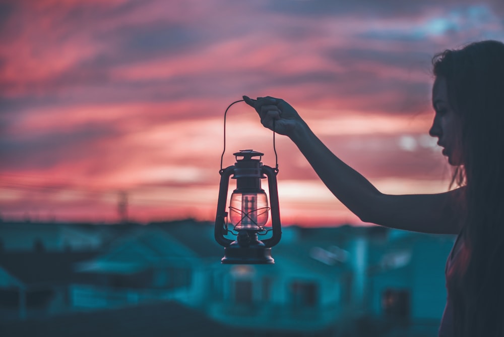 woman holding lantern