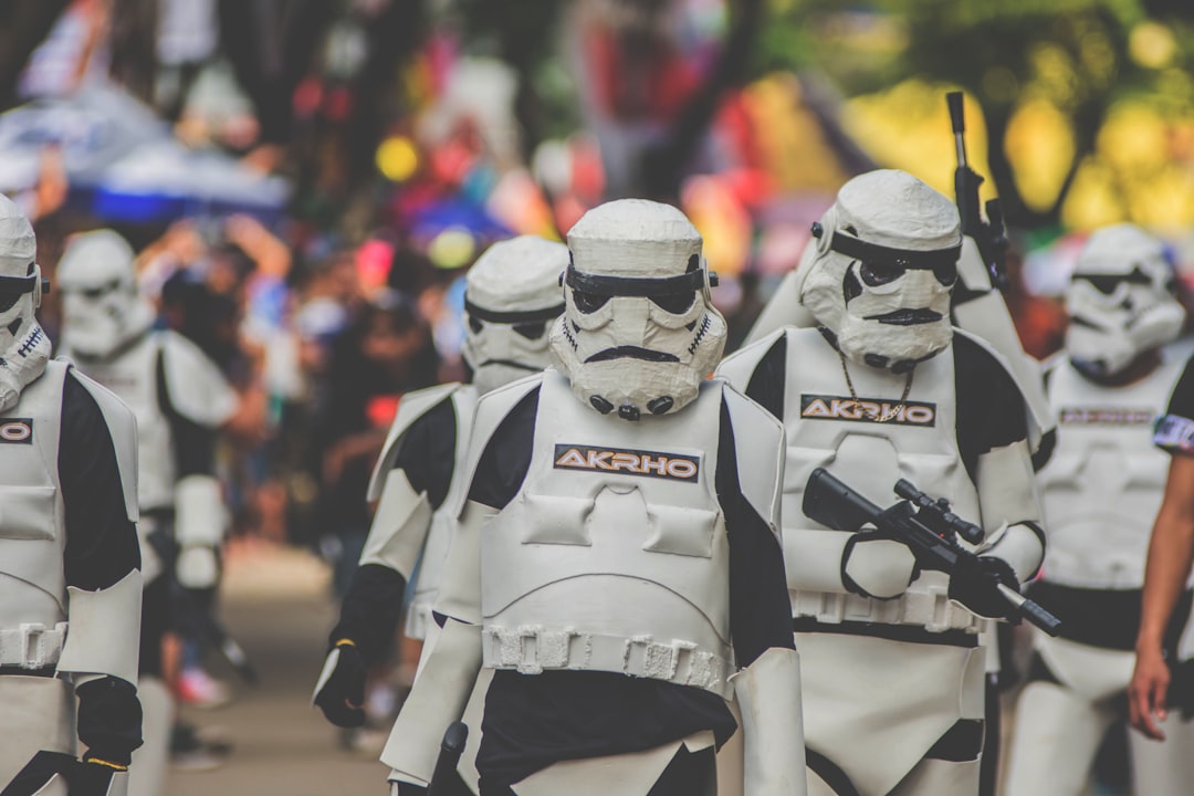 shallow focus photography of stormtrooper marching,