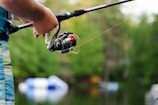 person holding fishing reel