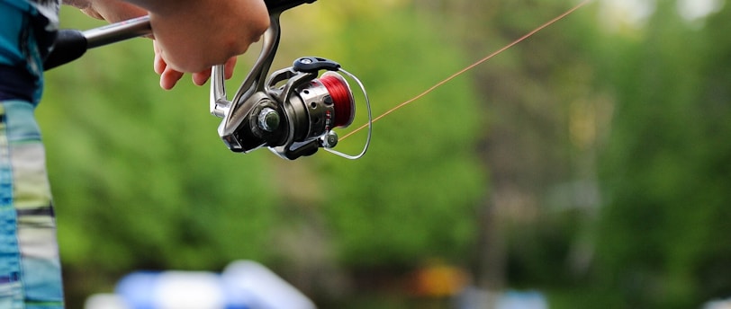 person holding fishing reel