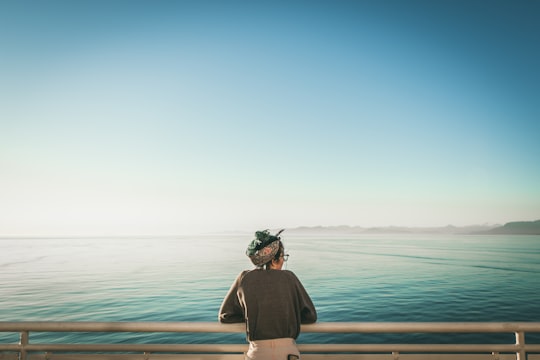 woman looking at ocean in Tsawwassen Canada