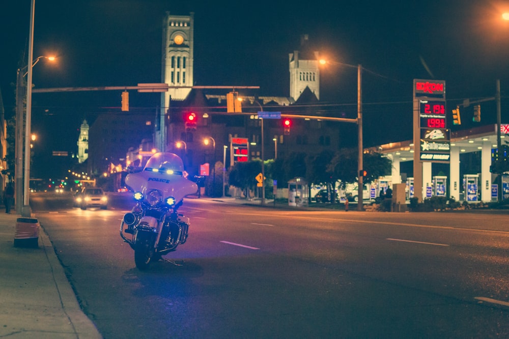 white police motorcycle park on road