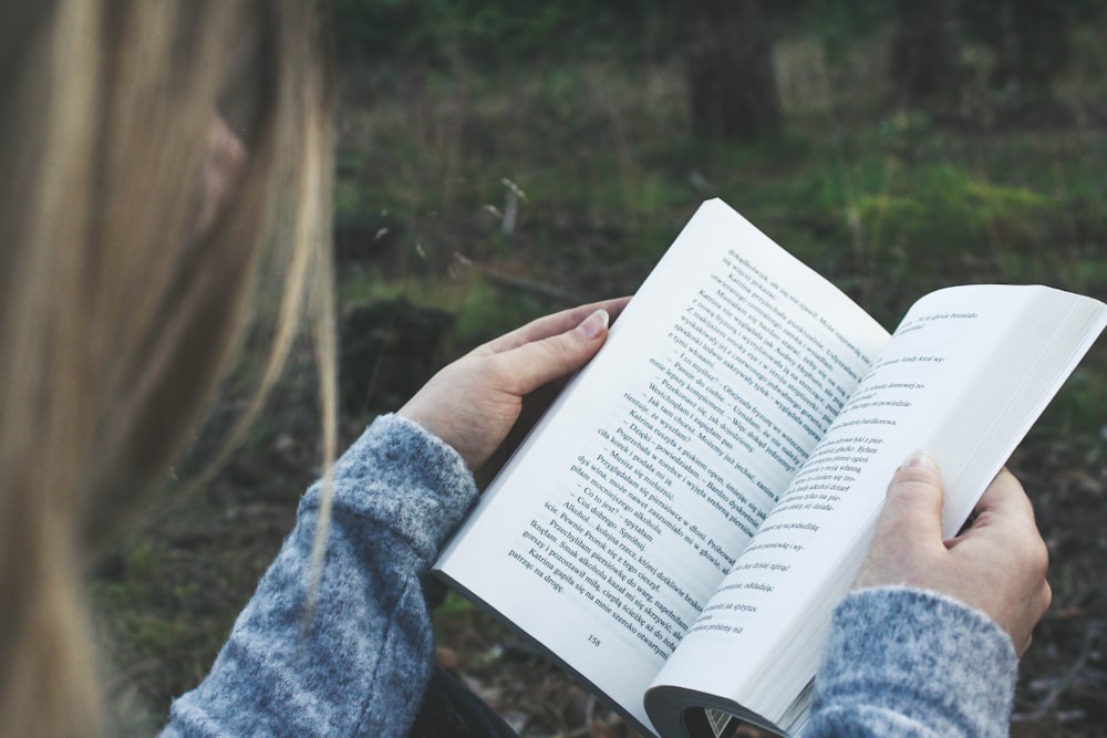 woman opening book