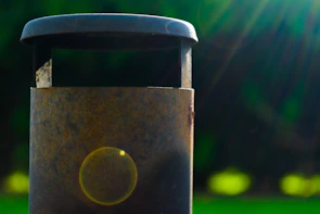 Close-up of a metallic urban waste bin with a smooth modern finish