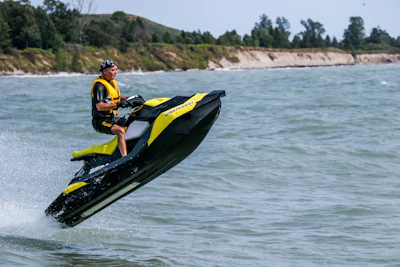 man riding personal watercraft