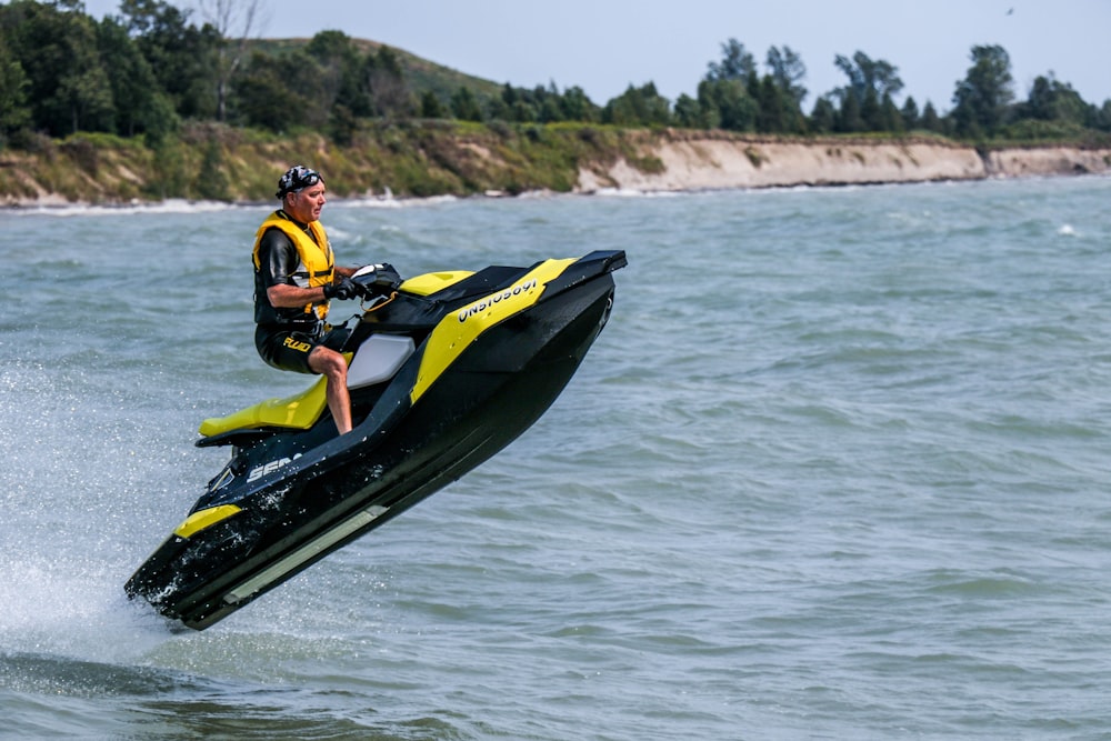 man riding personal watercraft