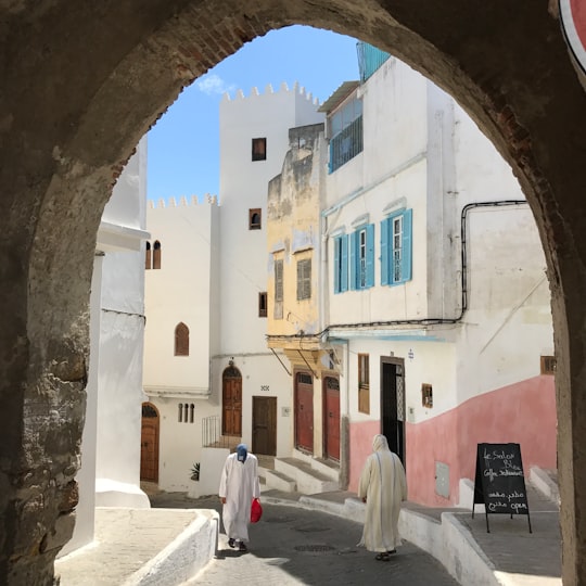 white and brown concrete building at daytime in Tangier Morocco