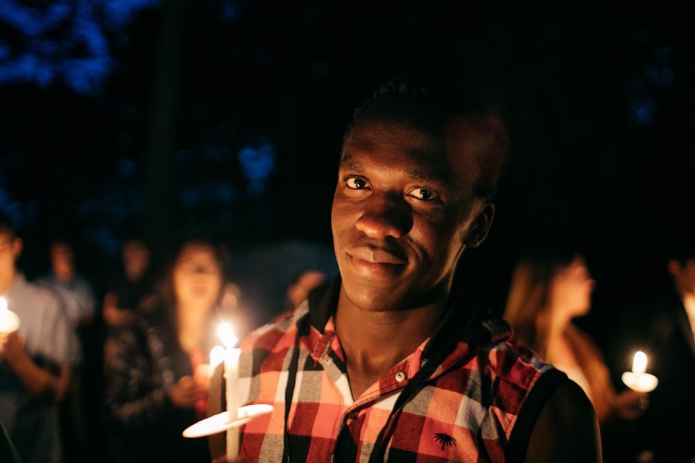 man holding candle