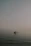 A serene morning fishing scene with a small boat gliding through calm archipelago waters.