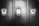 Three metal lockers are lined up side by side with a smooth, reflective surface. Two of the lockers have padlocks securing them, while the middle locker has an empty lock slot. The image is in black and white, highlighting the contrast between the shiny locks and the matte finish of the lockers.