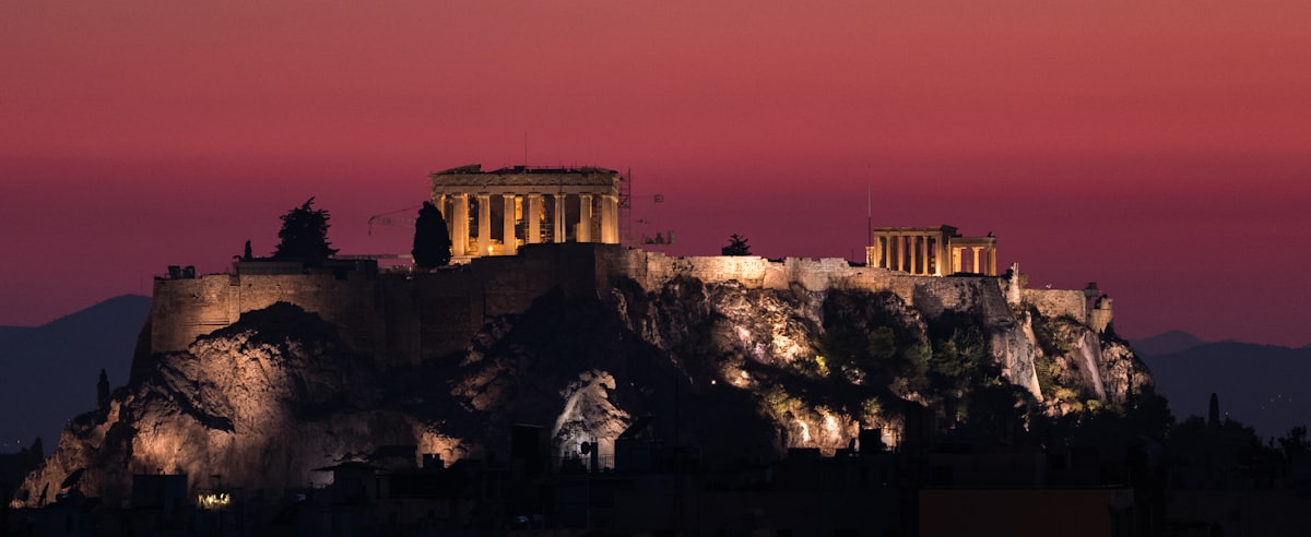 Athens December — the Acropolis and Parthenon illuminated against the night sky in the quiet of winter