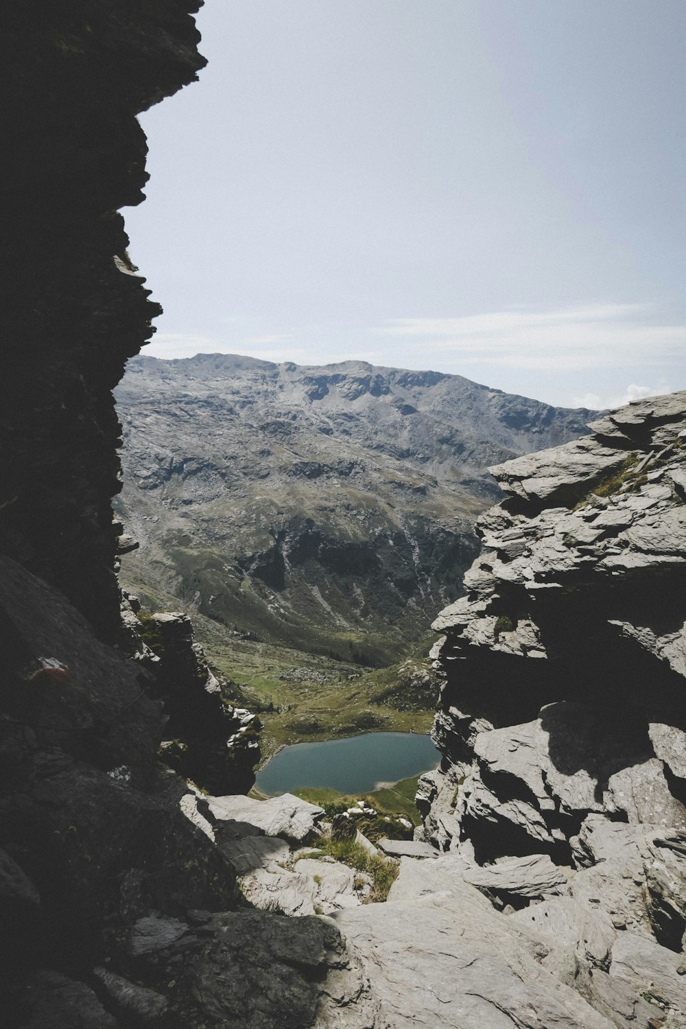 green mountains near lake at daytime