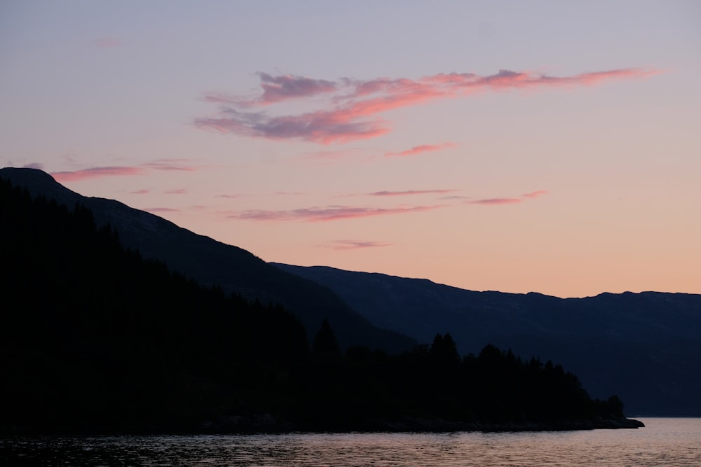 body of water near mountain