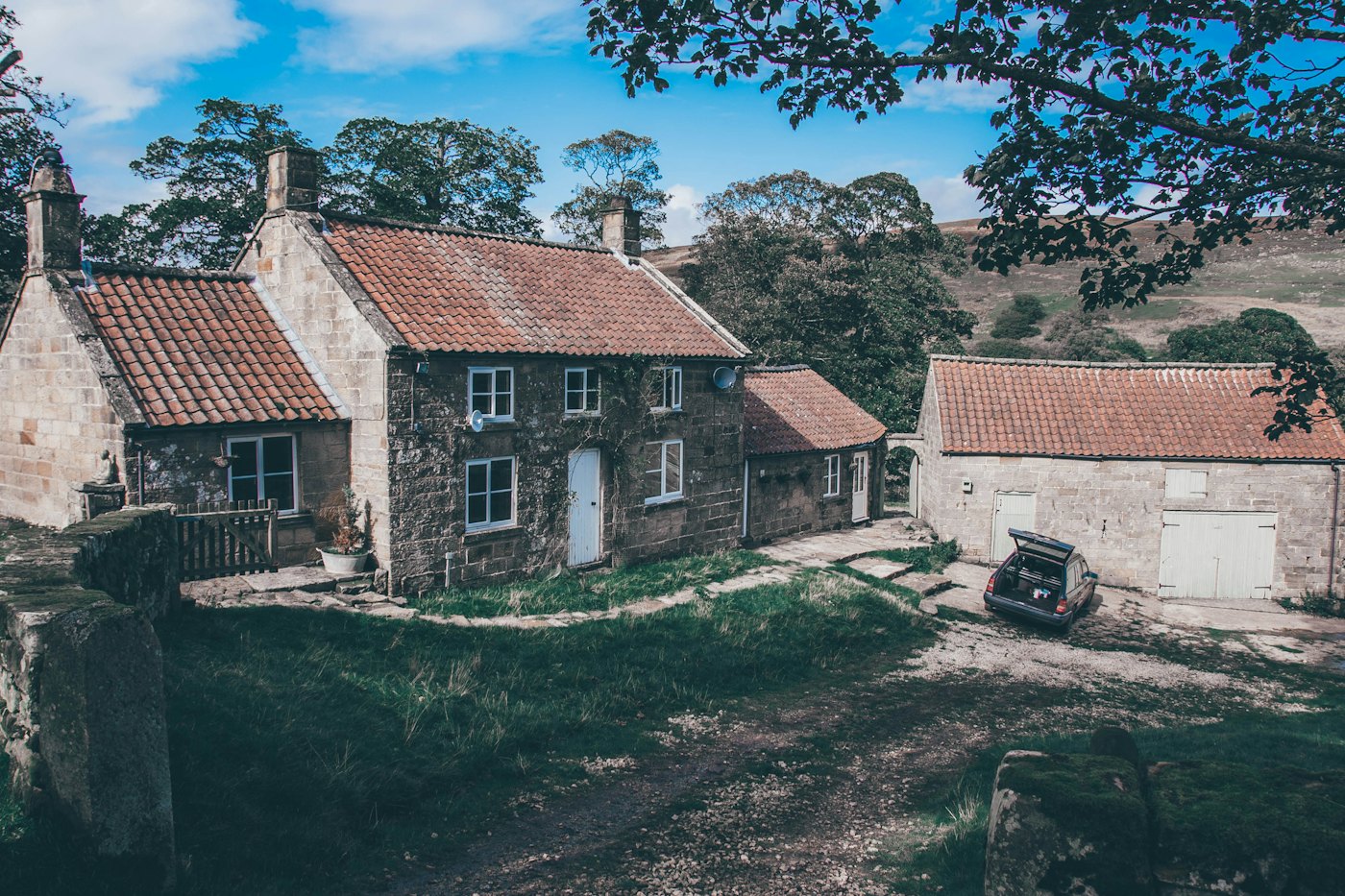 Ashcombe Hall and the tithe barn seen from the drive