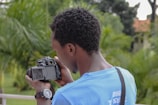man holding camera photo