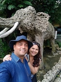 Couple taking selfie in front of the giant panda enclosure at Zoológico SP.