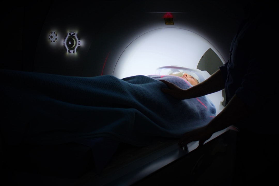person lying on ct-scan machine