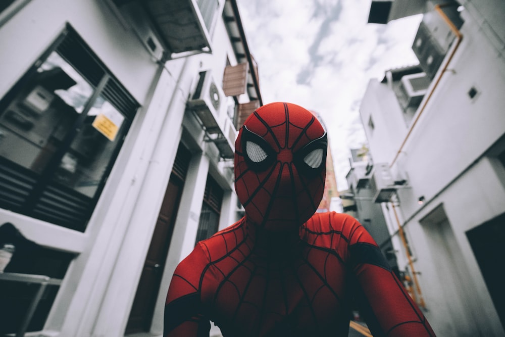 Spider-Man standing in the middle of buildings