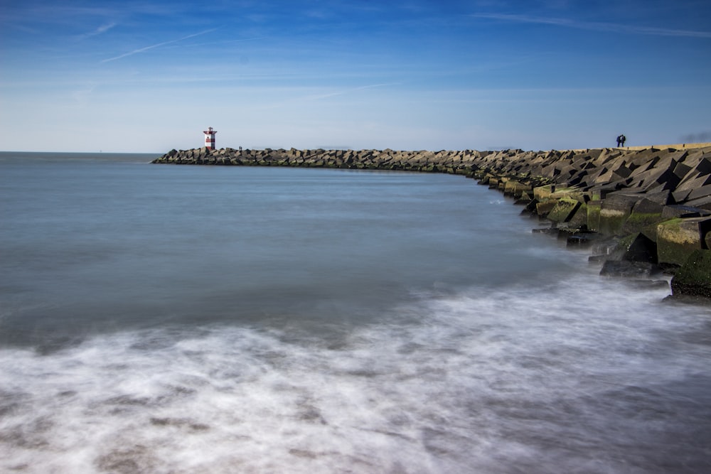 lighthouse near body of water