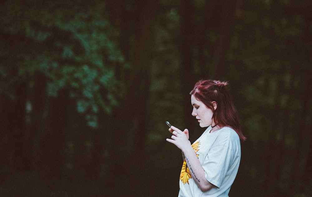 selective focus photography of woman staring on her phone