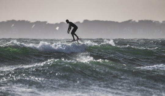 time lapse photography of man riding surfboard in Pornichet France