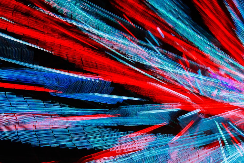 a blurry image of red, white and blue lights