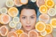 woman surrounded by sliced lemons