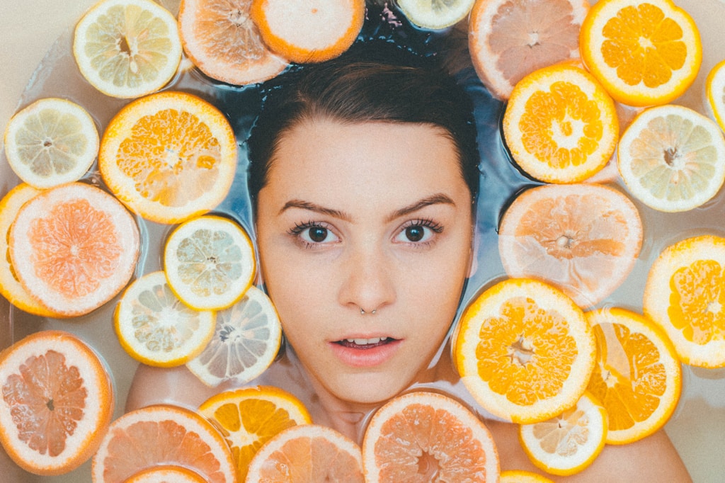 woman surrounded by sliced lemons