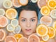 woman surrounded by sliced lemons