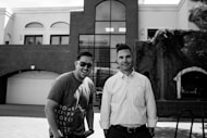 grayscale photography of two smiling men