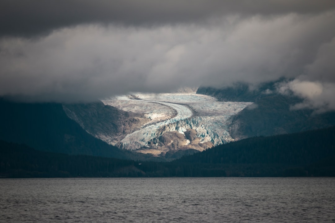 body of water near mountains